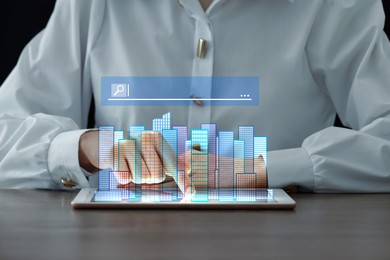 Image of Searching for housing online. Real estate agent using tablet computer at table, closeup. Search bar with buildings above device