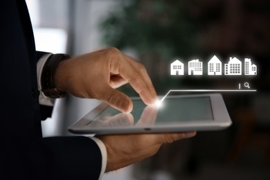 Image of Searching for housing online. Real estate agent using tablet computer indoors, closeup. Search bar with buildings above device