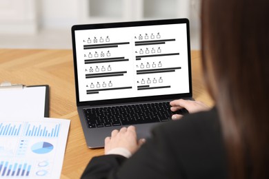Image of Woman passing online test on laptop at table, closeup