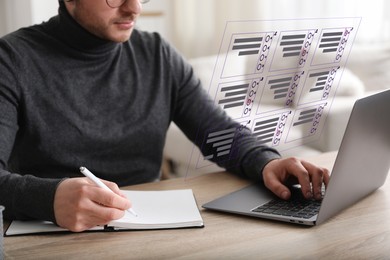 Image of Man passing online test on laptop and writing in notebook at table, closeup. Virtual form above computer