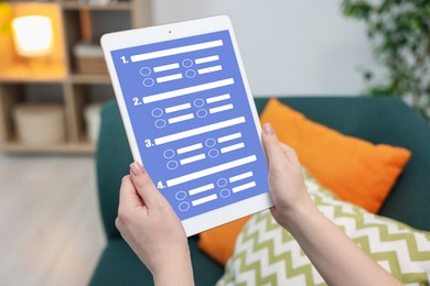 Image of Woman passing online test on tablet computer at home, closeup