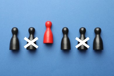 Image of Dismissal. Two human figures with white crosses among others on blue background, top view. Red figure - boss or HR manager