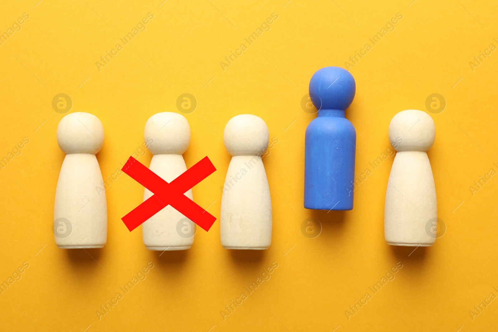 Dismissal. One human figure with red cross among others on orange background, top view Image of Dismissal. One human figure with red cross among others on orange background, top view