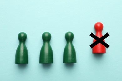 Image of Dismissal. One red human figure with black cross among green ones on light blue background, top view