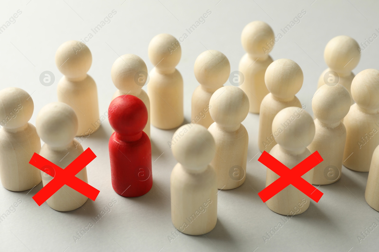 Dismissal. Two human figures with red crosses among others on white table Image of Dismissal. Two human figures with red crosses among others on white table