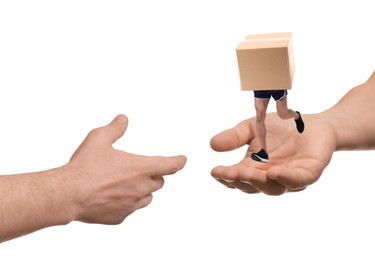 Image of Cardboard box with man's legs running from one hand to another on white background. Fast delivery