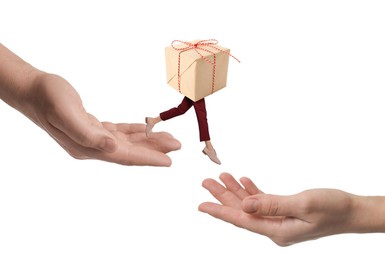 Image of Gift box with woman's legs jumping from one hand to another on white background