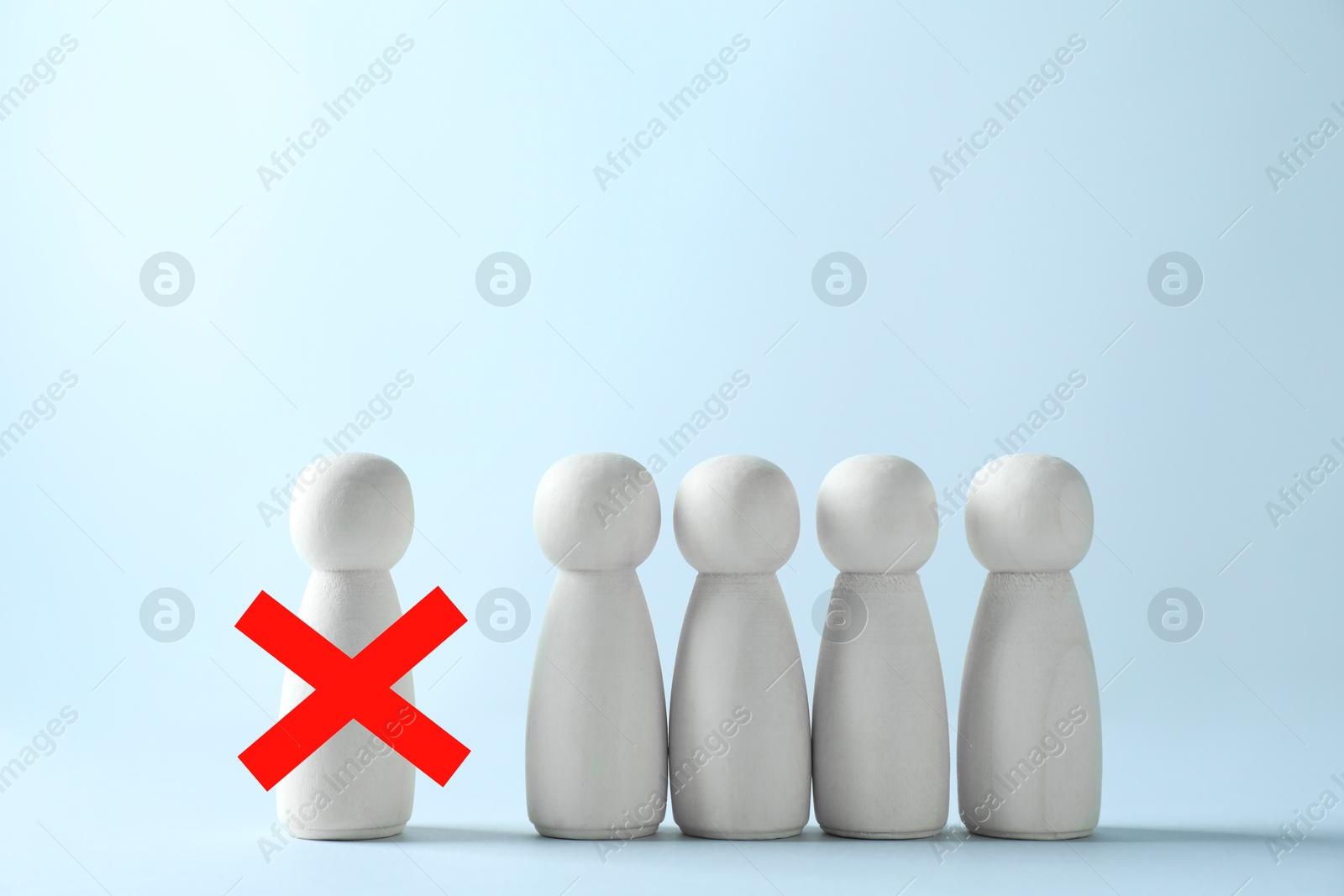 Image of Dismissal. One human figure with red cross among others against light blue background