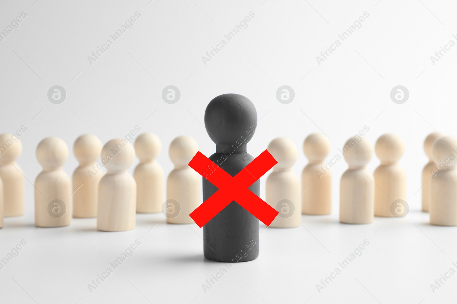 Dismissal. One grey human figure with red cross among others on white table Image of Dismissal. One grey human figure with red cross among others on white table