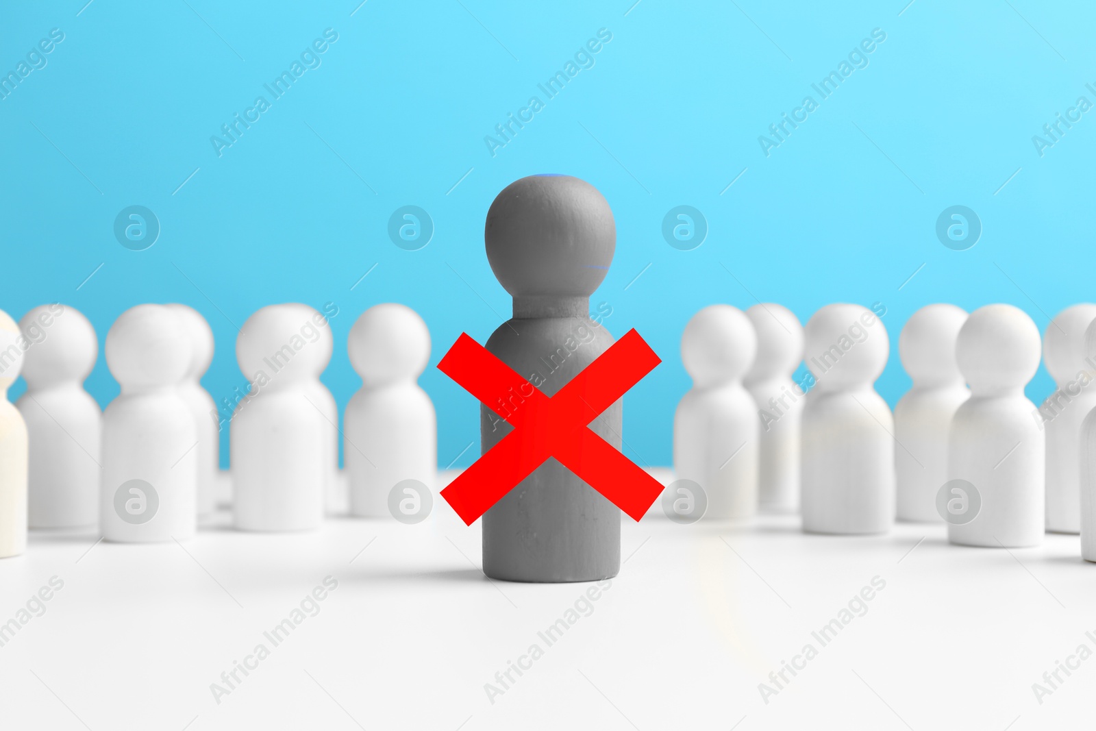 Dismissal. One grey human figure with red cross among others on white table Image of Dismissal. One grey human figure with red cross among others on white table