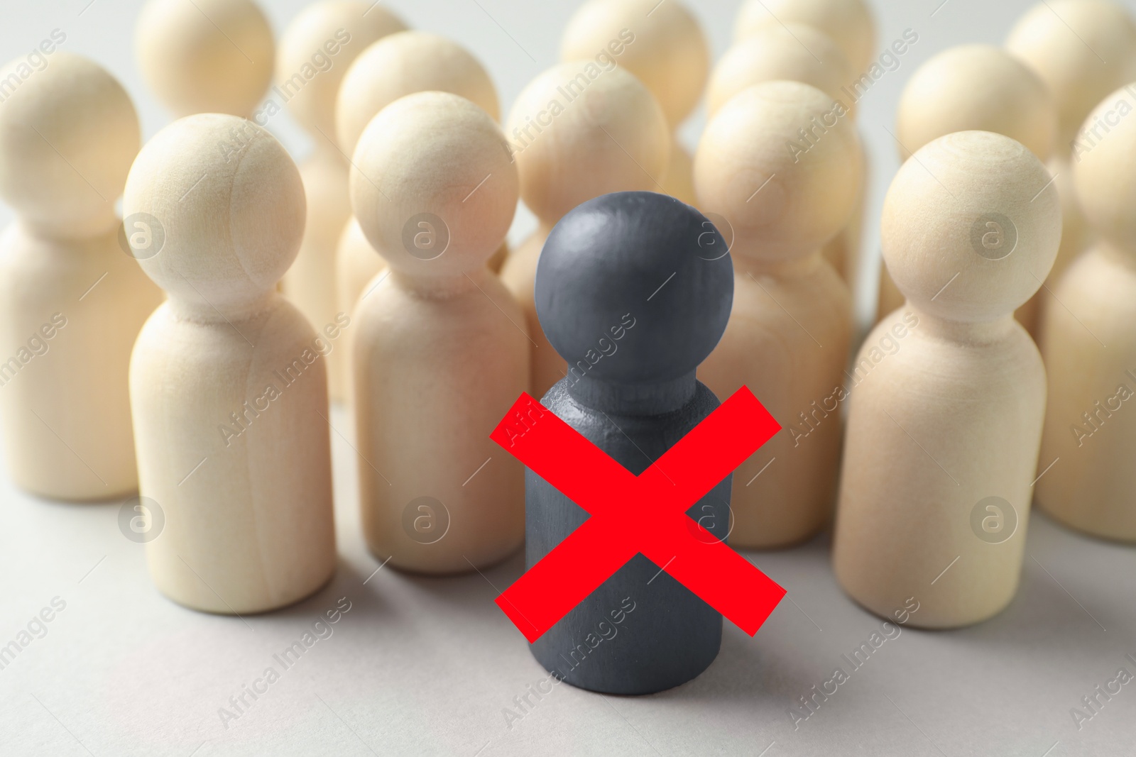 Dismissal. One grey human figure with red cross among others on white table Image of Dismissal. One grey human figure with red cross among others on white table