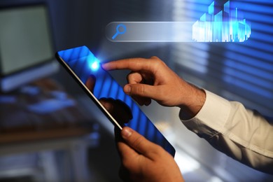Image of Searching for housing online. Real estate agent using tablet computer indoors, closeup. Search bar with buildings above device