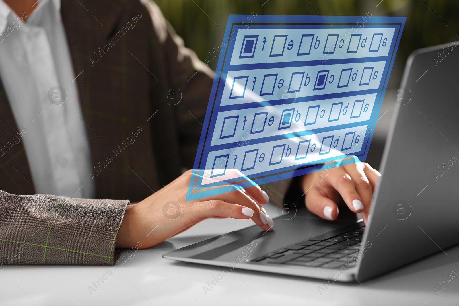 Image of Woman passing online test on laptop at table, closeup. Virtual form above computer