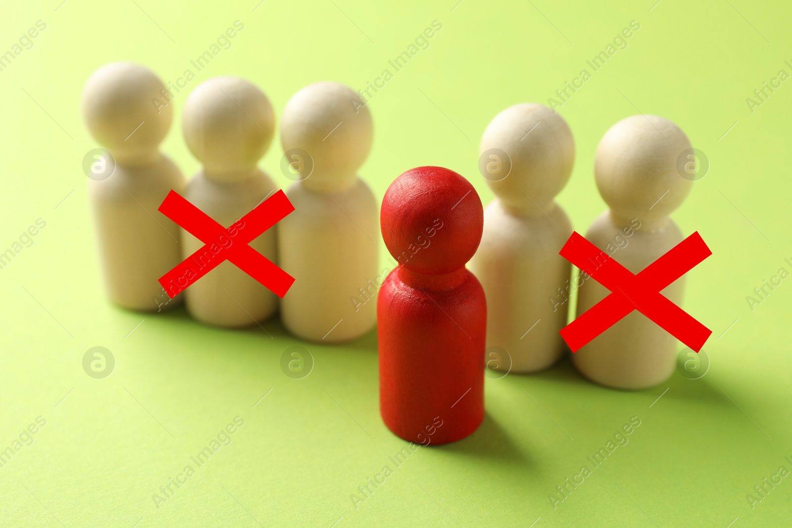 Dismissal. Two human figures with red crosses among others on light green background. Red figure - boss or HR manager Image of Dismissal. Two human figures with red crosses among others on light green background. Red figure - boss or HR manager