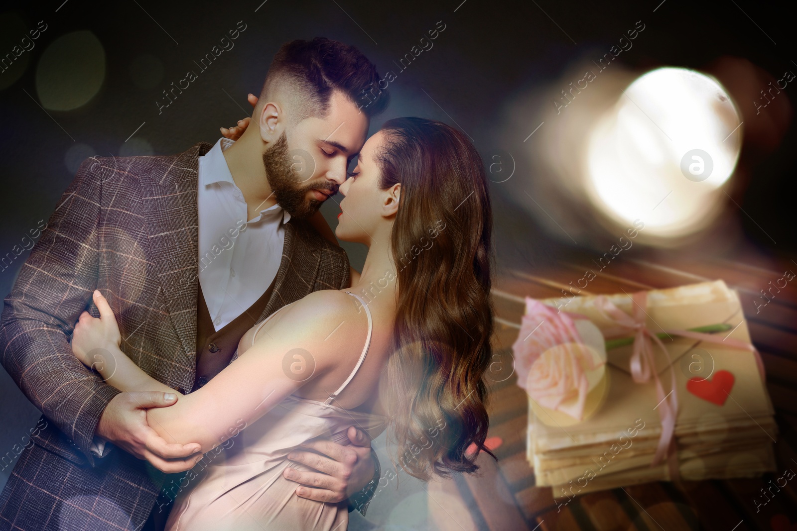 Romantic young couple and stack of love letters, bokeh effect Image of Romantic young couple and stack of love letters, bokeh effect