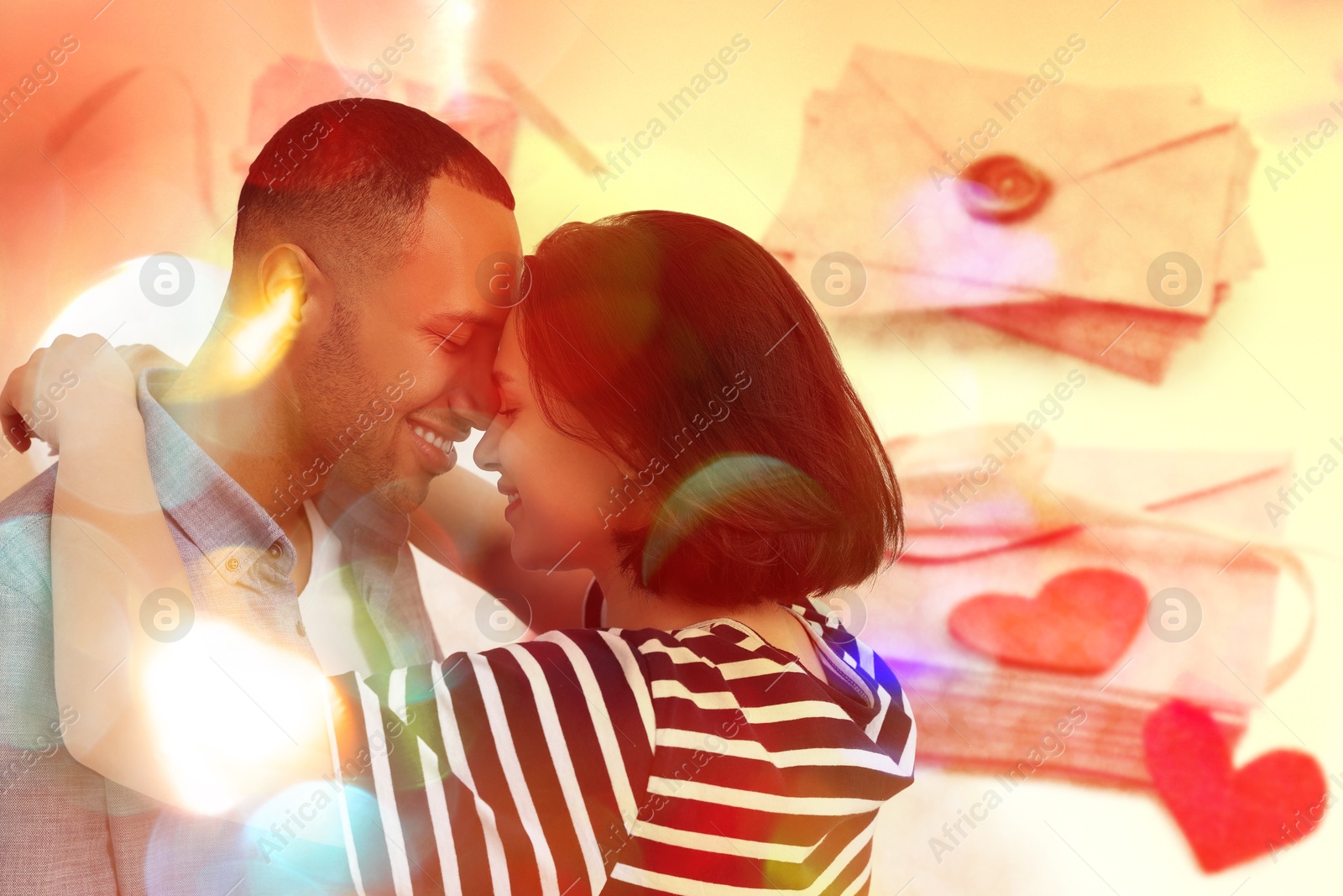 Romantic young couple and love letters, bokeh effect. Woman hugging her beloved man Image of Romantic young couple and love letters, bokeh effect. Woman hugging her beloved man