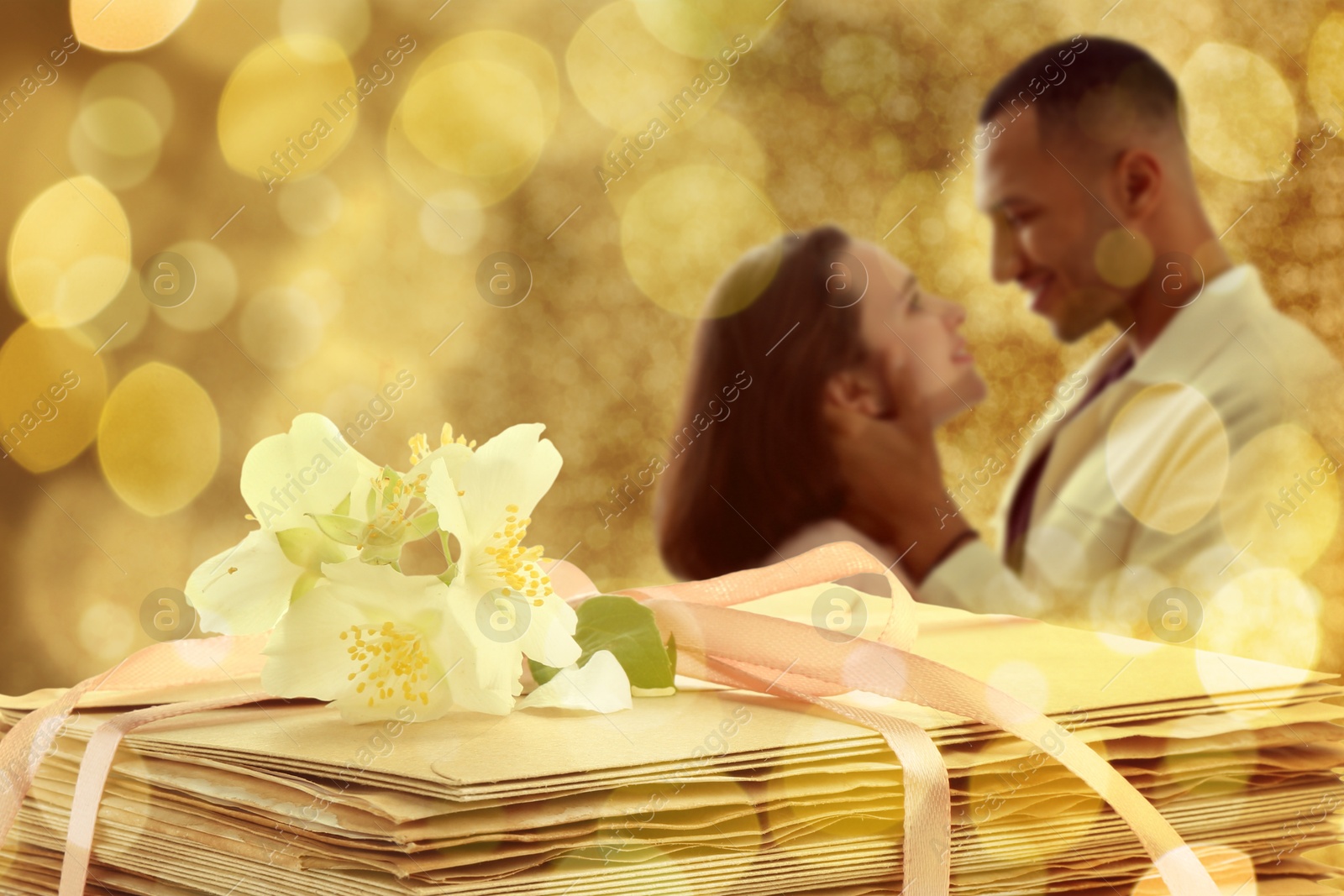 Romantic young couple and stack of love letters, bokeh effect Image of Romantic young couple and stack of love letters, bokeh effect