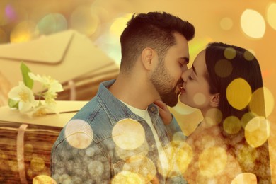 Image of Romantic young couple and love letters, bokeh effect. Woman and man kissing