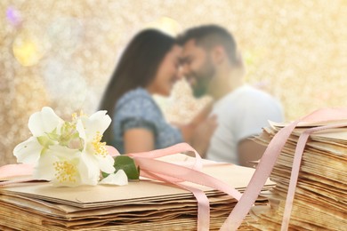 Image of Romantic young couple and love letters, bokeh effect