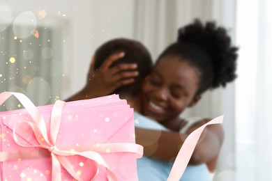 Image of Romantic young couple at home and love letters, bokeh effect. Woman hugging her beloved man