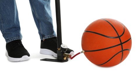 Photo of Man inflating basketball ball with manual air pump on white background, closeup