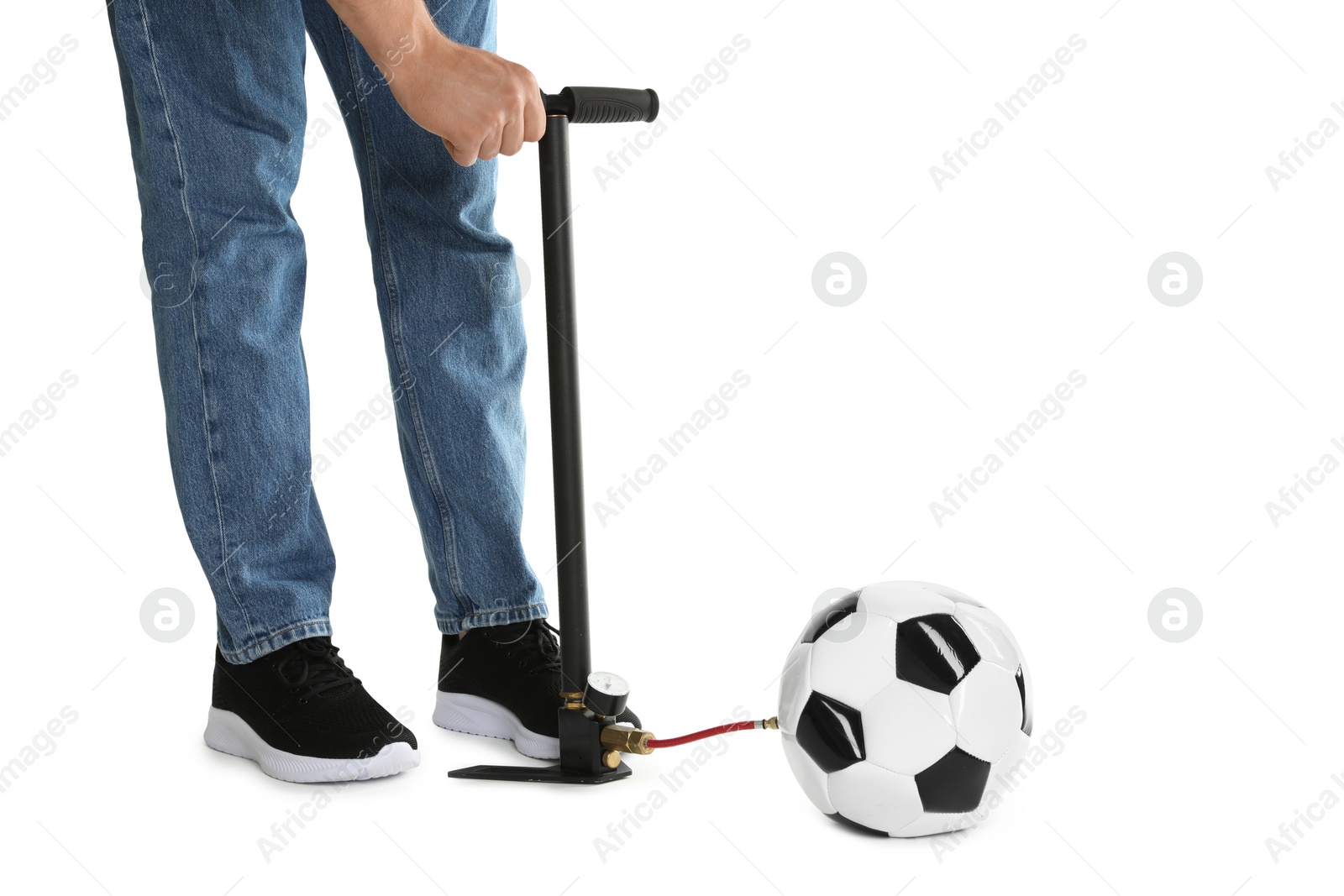 Photo of Man inflating soccer ball with manual air pump on white background, closeup