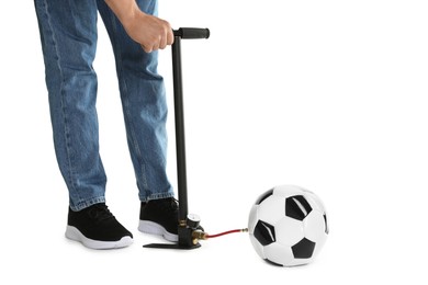 Photo of Man inflating soccer ball with manual air pump on white background, closeup