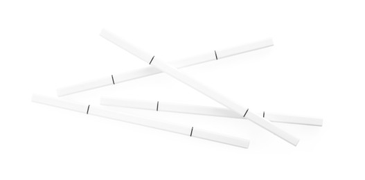 Photo of Many twist up eyebrow pencils isolated on white, top view