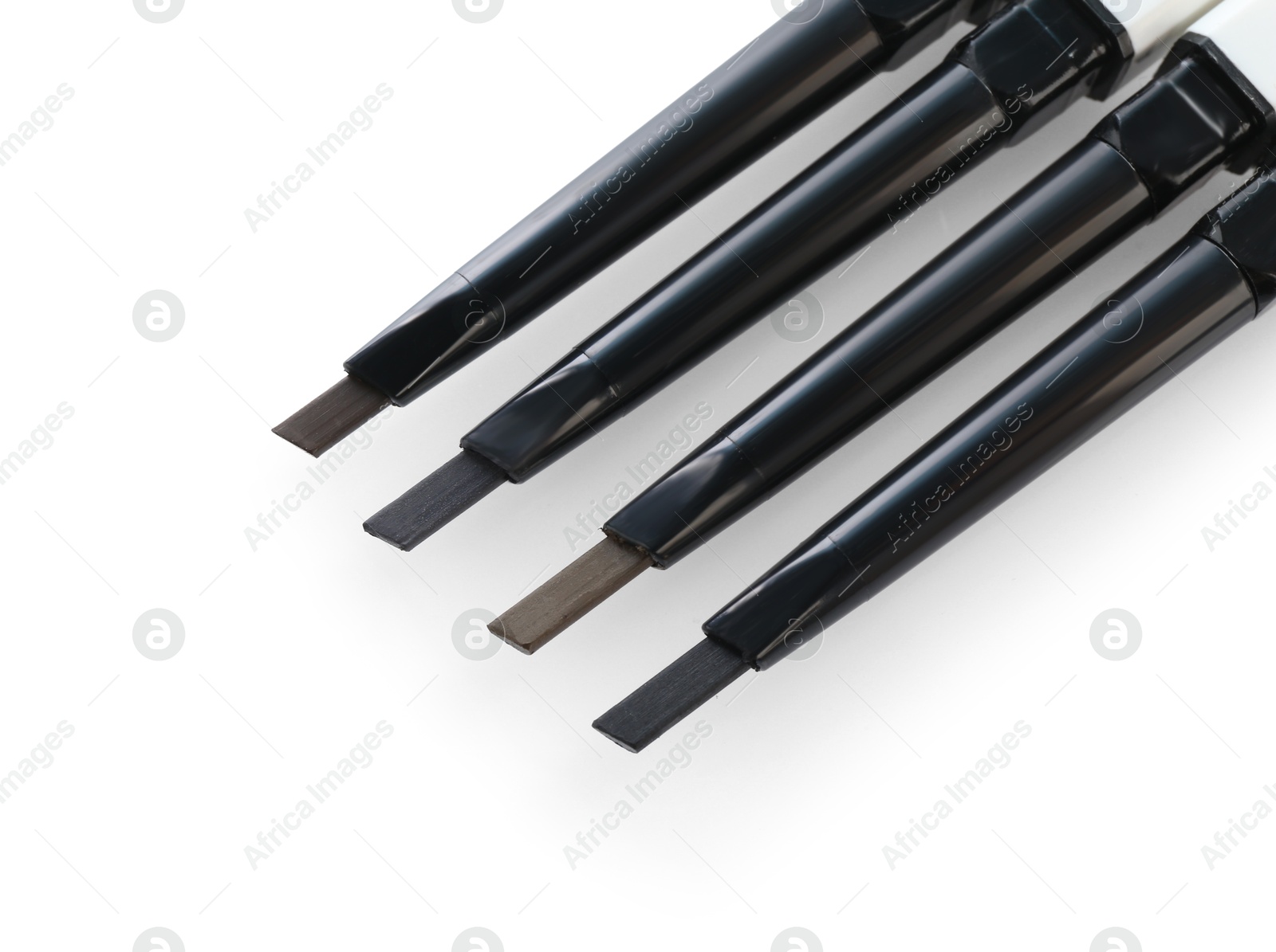 Photo of Many twist up eyebrow pencils isolated on white