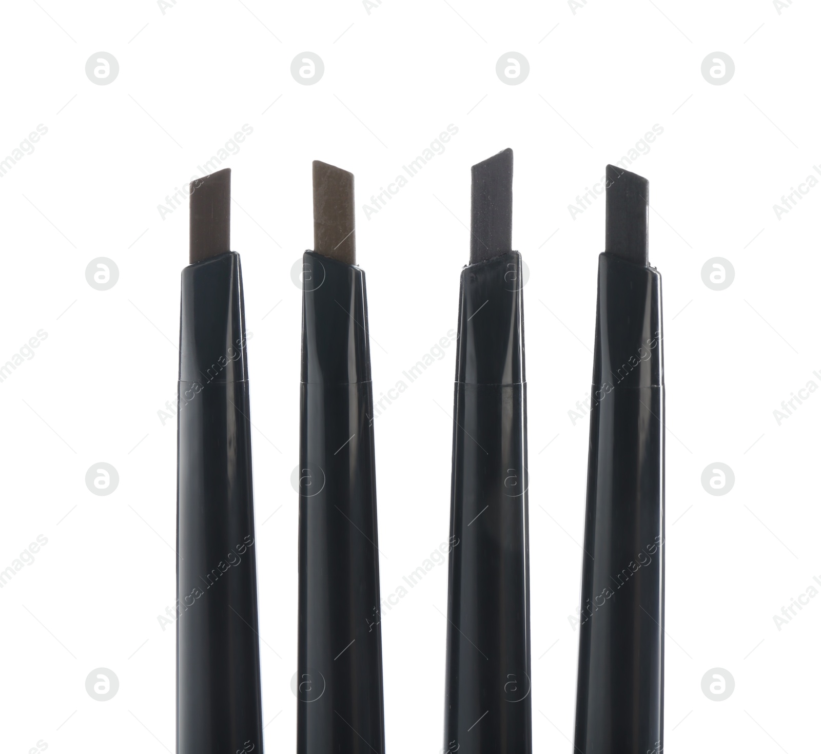 Photo of Many twist up eyebrow pencils isolated on white, top view