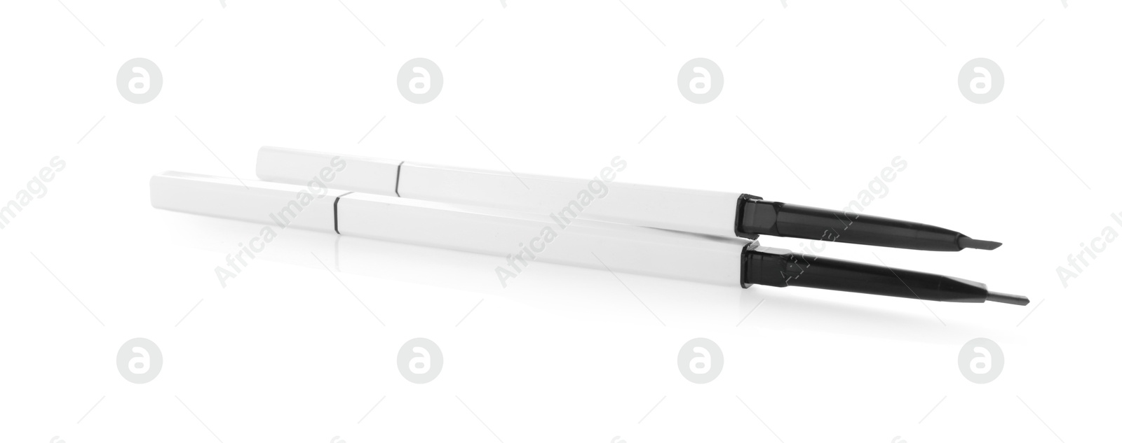 Photo of Two twist up eyebrow pencils isolated on white
