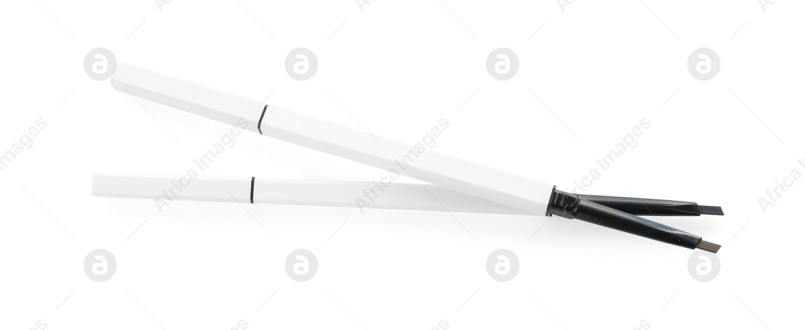 Photo of Two twist up eyebrow pencils isolated on white, top view