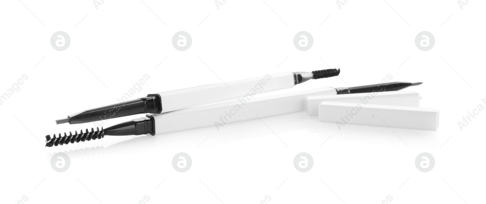 Photo of Two twist up eyebrow pencils isolated on white
