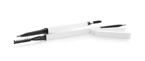 Photo of Two twist up eyebrow pencils isolated on white