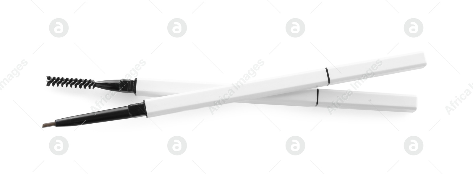 Photo of Two twist up eyebrow pencils isolated on white, top view