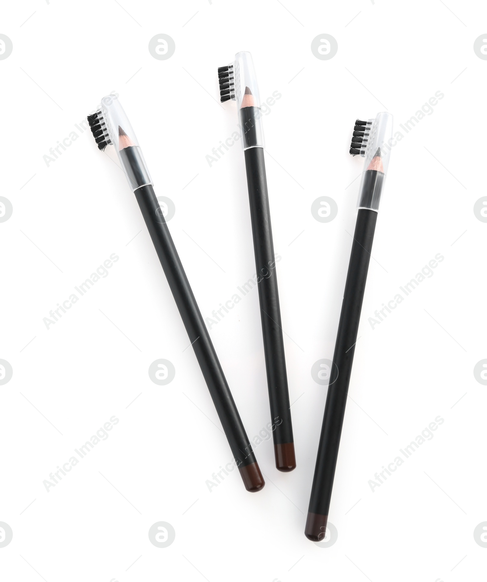 Photo of Three different eyebrow pencil isolated on white, top view