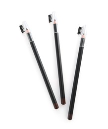 Photo of Three different eyebrow pencil isolated on white, top view