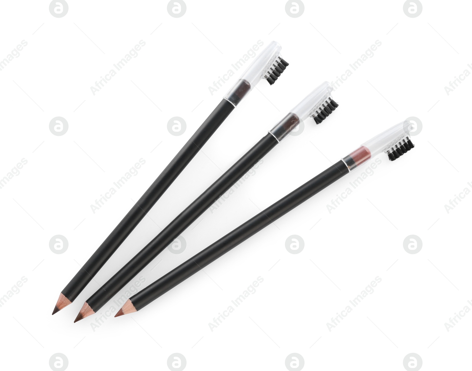 Photo of Three different eyebrow pencil isolated on white, top view