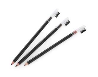 Photo of Three different eyebrow pencil isolated on white, top view