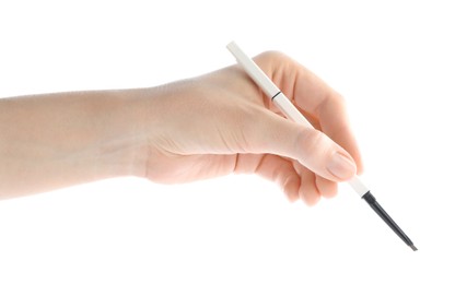 Photo of Woman with eyebrow pencil on white background, closeup