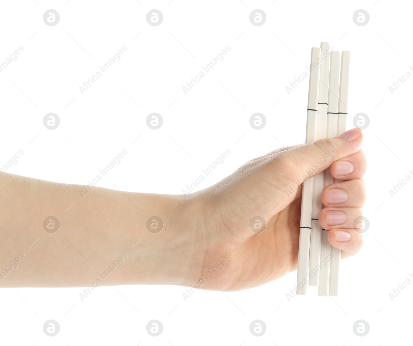 Photo of Woman with eyebrow pencils on white background, closeup