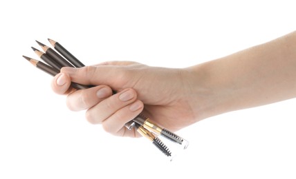 Photo of Woman with eyebrow pencils on white background, closeup