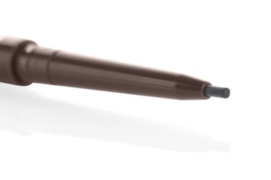 Photo of One twist up brown eyebrow pencil isolated on white