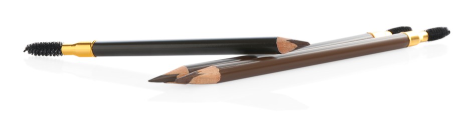 Photo of Different eyebrow pencil with brushes isolated on white
