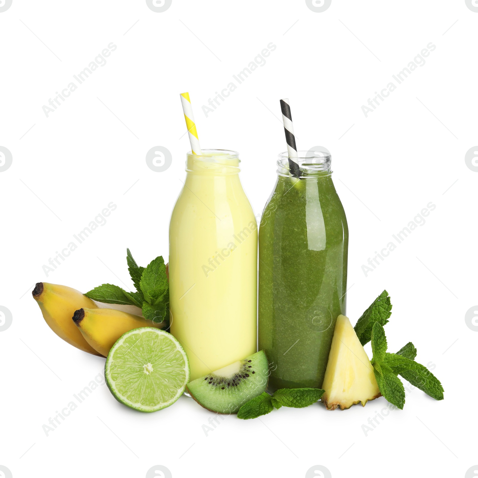 Photo of Superfood. Tasty smoothies in glass bottles and ingredients isolated on white