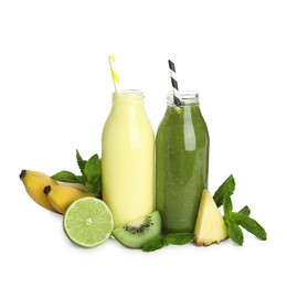 Photo of Superfood. Tasty smoothies in glass bottles and ingredients isolated on white