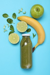 Photo of Superfood. Tasty smoothie in glass bottle and ingredients on light blue background, flat lay