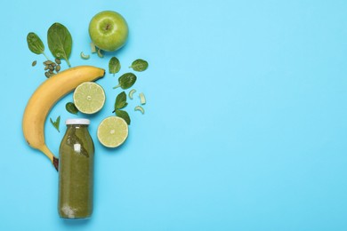 Photo of Superfood. Tasty smoothie in glass bottle and ingredients on light blue background, flat lay. Space for text