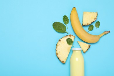 Photo of Superfood. Tasty smoothie in glass bottle and ingredients on light blue background, flat lay. Space for text
