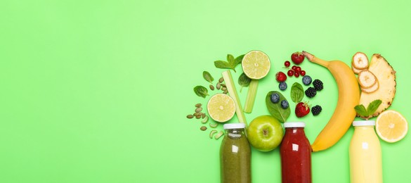 Photo of Superfood. Tasty smoothies in glass bottles and ingredients on green background, flat lay. Space for text